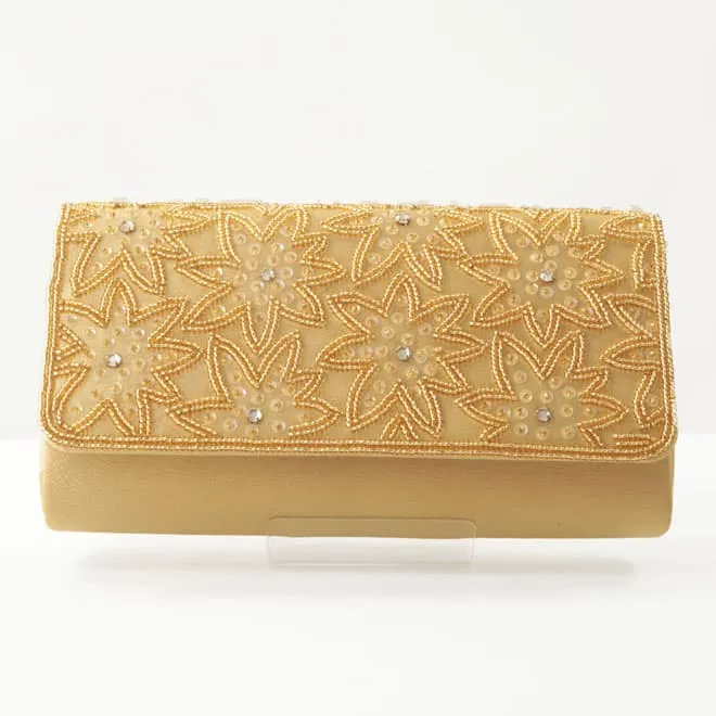 ゴールドのボタニカル柄バッグ