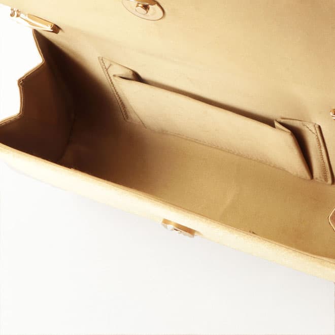 ゴールドのボタニカル柄バッグ