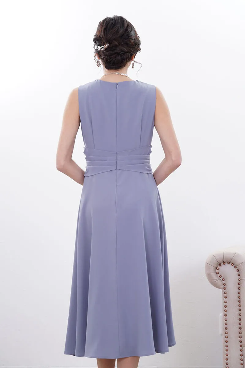 ブルーのウエストモチーフカシュクールドレス