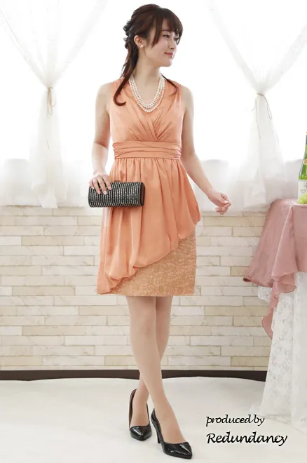 オレンジピンクのアシンメトリー切替タイトドレス