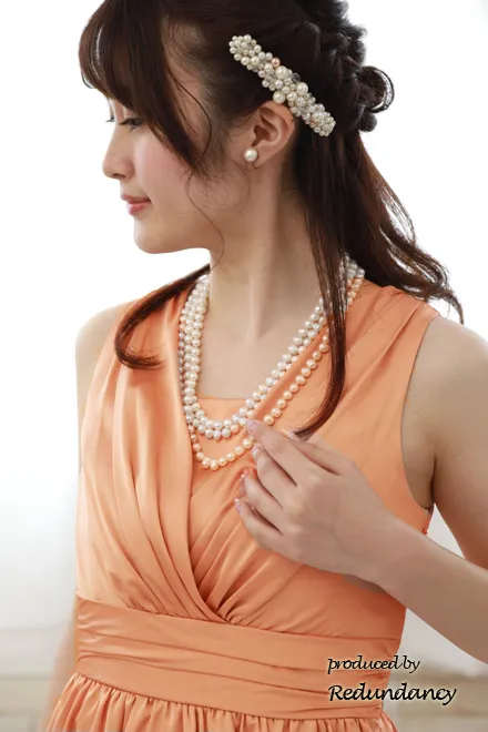 オレンジピンクのアシンメトリー切替タイトドレス