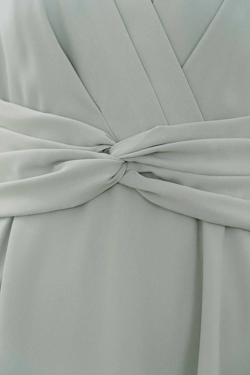 ライトグリーンのウエストモチーフカシュクールドレス