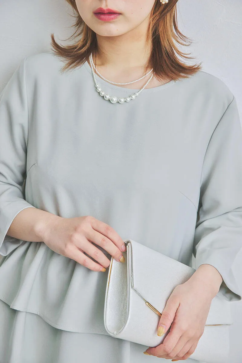 ライトグリーン×ブラックのペプラムトップスパンツドレス