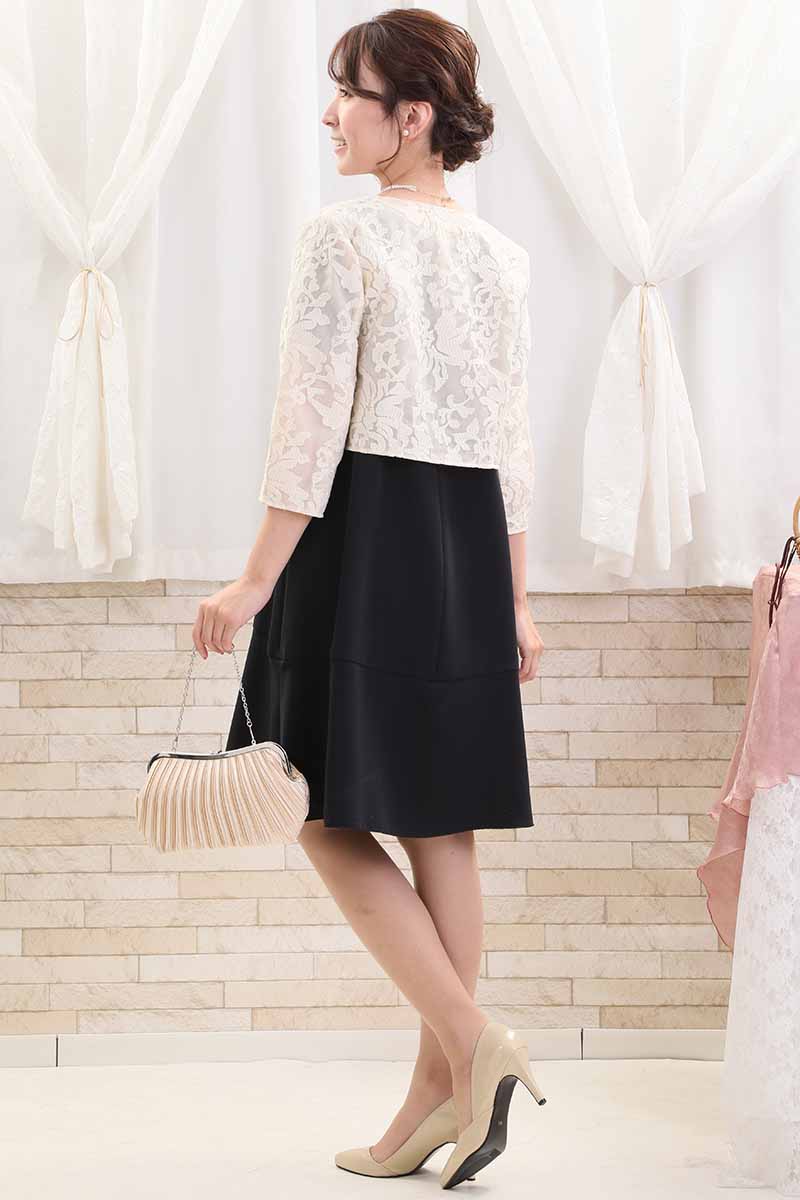 ネイビーのスリット入りフリルスリーブドレス