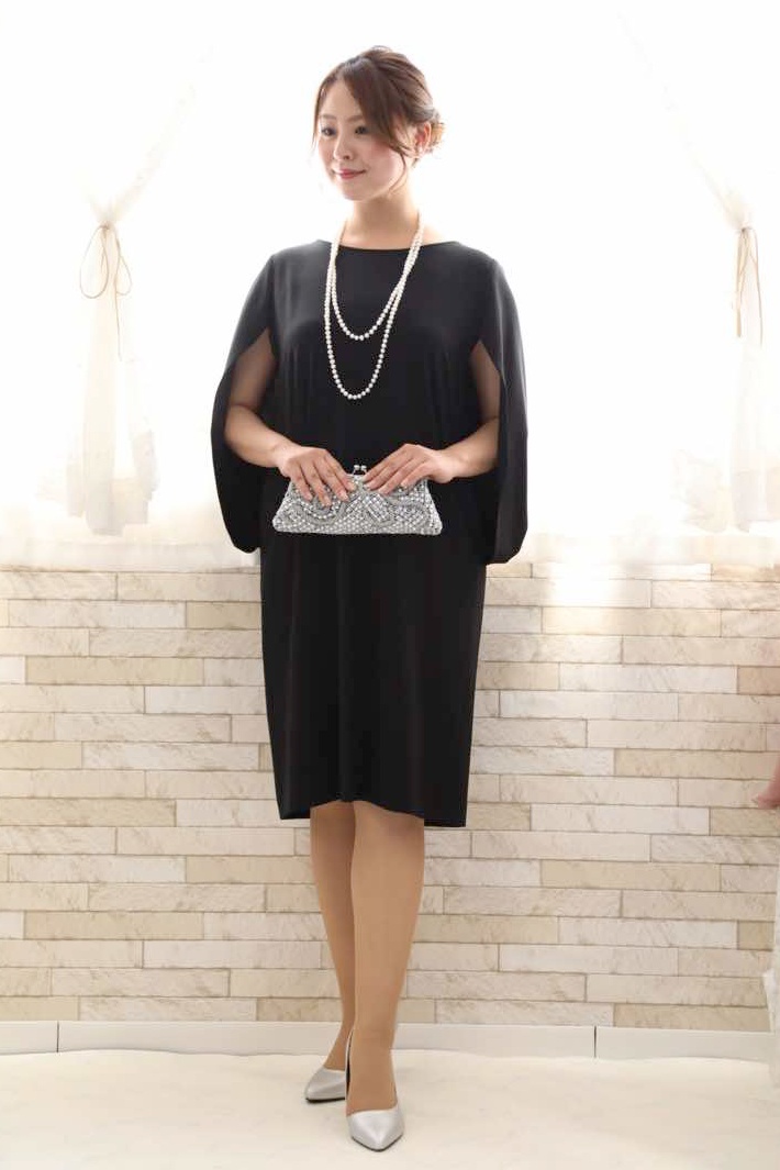 ネイビーのケープスリーブドレス