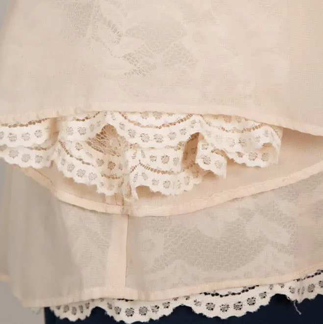 ベージュのリバーシブルボレロ