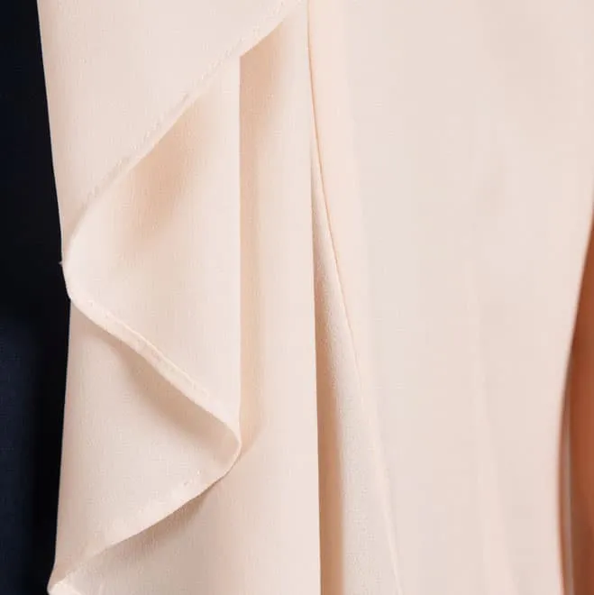 ピンクベージュの七分袖ボレロ