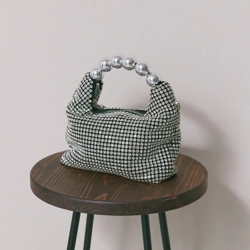 シルバーのボールハンドルバッグ