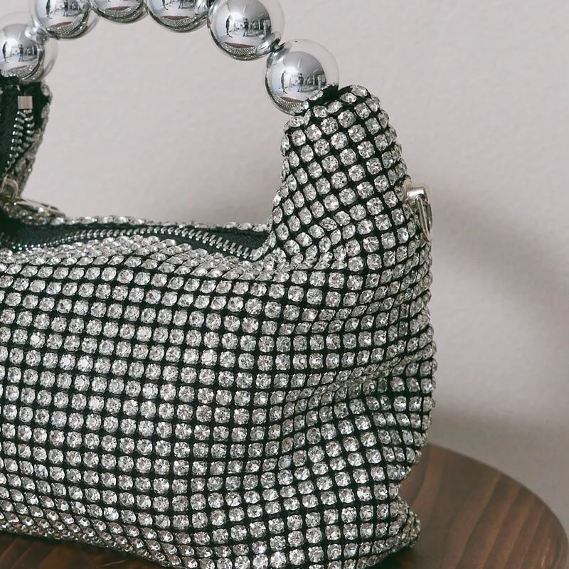 シルバーのボールハンドルバッグ