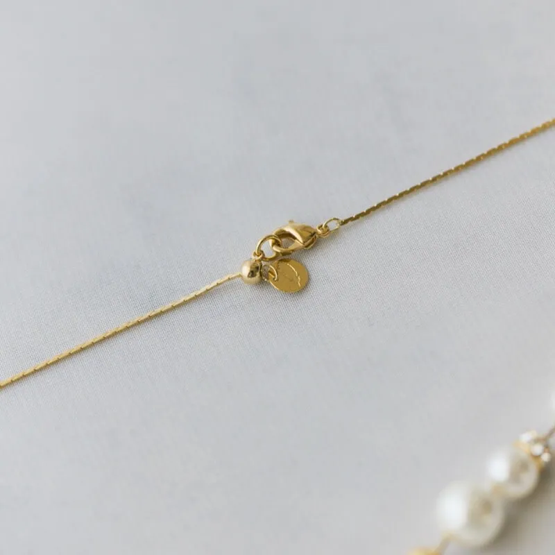 ゴールドのパール×ダストボールネックレス