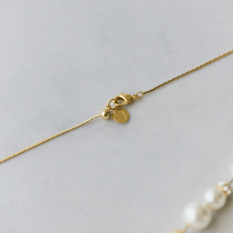 ゴールドのパール×ダストボールネックレス