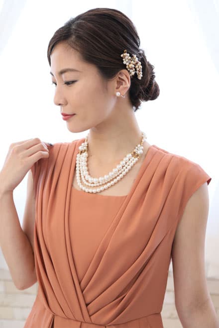 オレンジのカシュクール風タック入りドレス