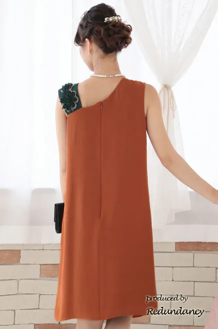 オレンジ×グリーンのショルダーモチーフドレス