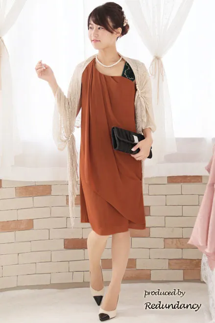 オレンジ×グリーンのショルダーモチーフドレス