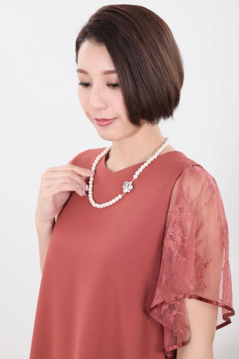 オレンジのフレアレーススリーブAラインドレス