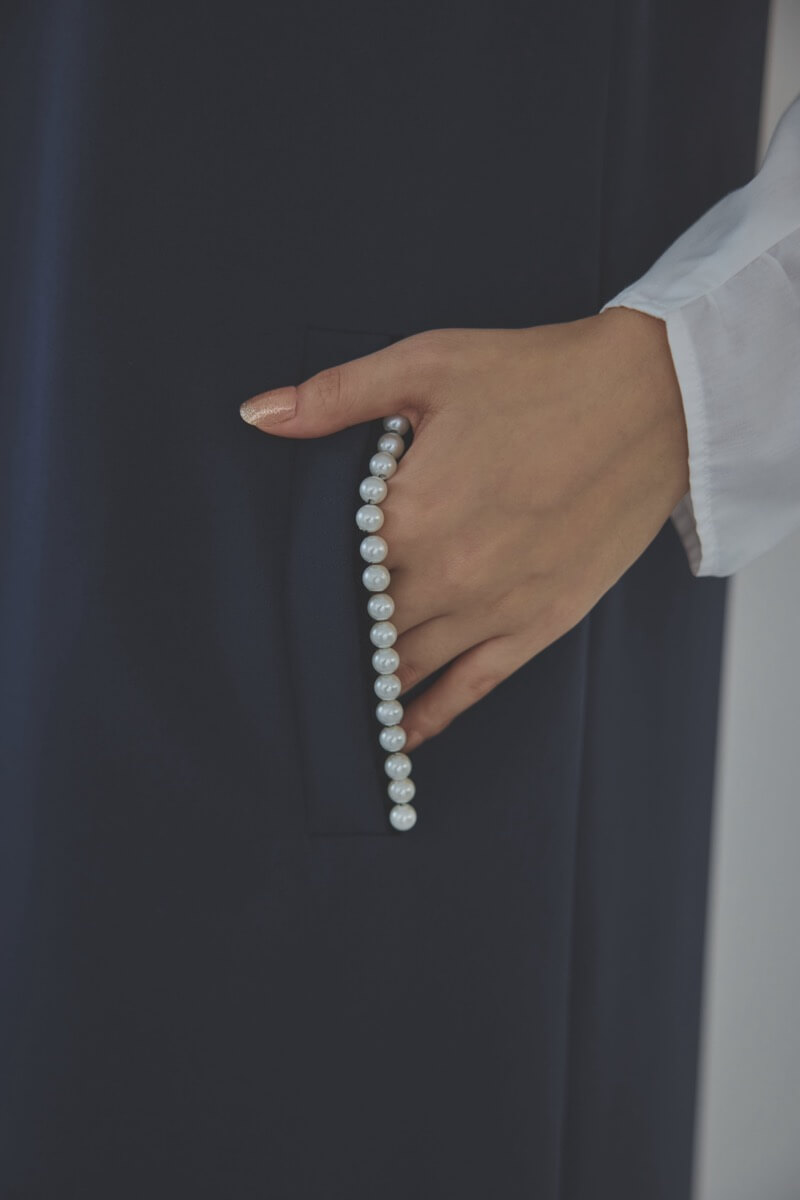 ネイビーのパールボタンジレスーツセット